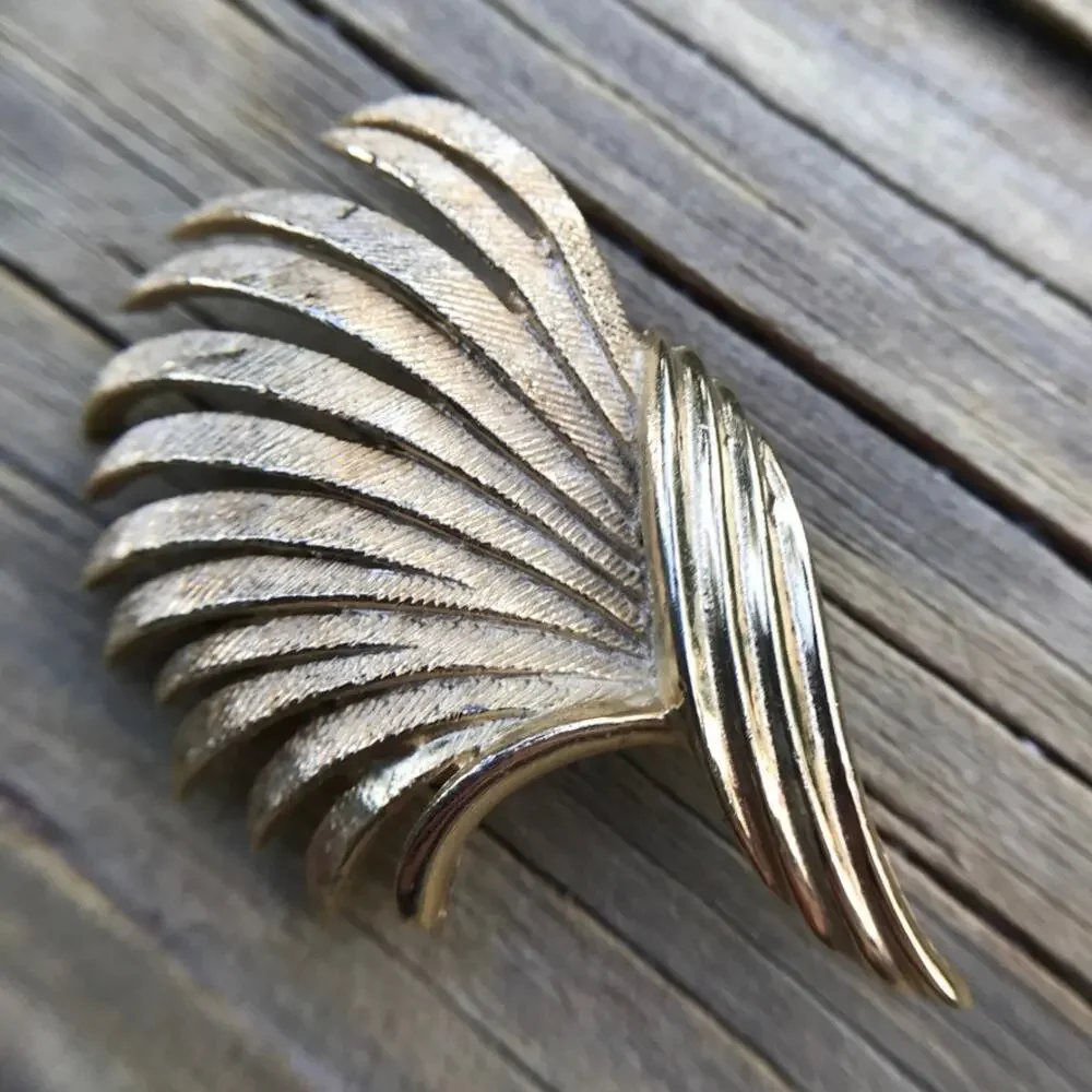 Estate signed CORO brushed gold tone textural swirl brooch / pin
